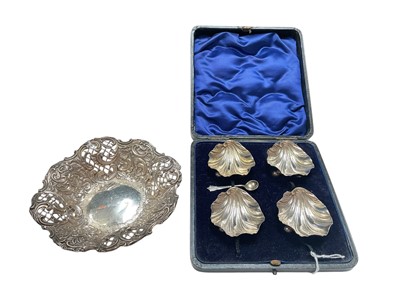 Lot 149 - Set of four late Victorian silver shell shaped salts with one salt spoon in fitted case (Sheffield 1900) and a Victorian silver bon bon dish with pierced decoration