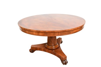 Lot 1404 - Victorian mahogany circular tilt-top dining table on tapered column and trefoil plateau base with carved scroll feet and castors, 121cm diameter
