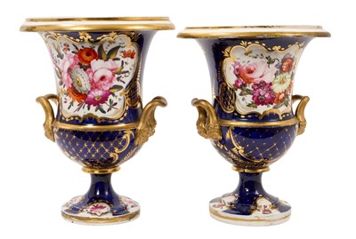 Lot 30 - Large pair of early 19th century English porcelain campana shape urns / vases, possibly Coalport, polychrome painted with flowers on a gilt and cobalt blue ground, 23.25cm high