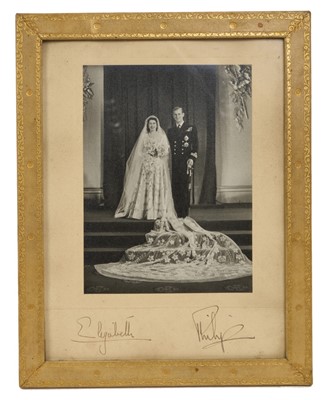 Lot 154 - T.R.H. The Princess Elizabeth (later H.M. Queen Elizabeth II) and The Duke of Edinburgh, signed 1947 wedding portrait photograph