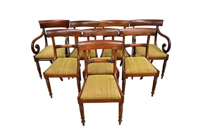 Lot 1352 - Set of eight George IV mahogany dining chairs, comprising six standards and a pair of carvers with scroll arms, each with drop-in seat