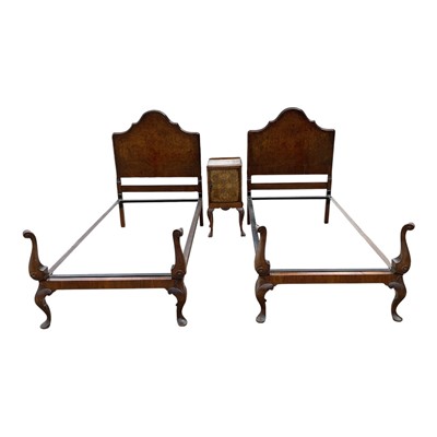 Lot 1359 - Pair of 1930s Heals walnut single beds and matching bedside cupboard