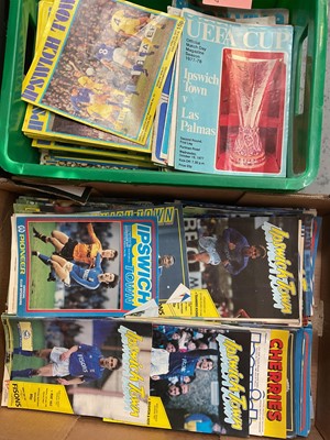 Lot 1112 - Ipswich - 5 boxes of programmes and memorabilia. 850+ programmes 1970s-2000s including Cup Final, Europe and testimonials. 1978 FA Cup final newspapers and cuttings, signed pictures including Ja...