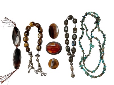 Lot 171 - Two white metal mounted agate brooches, banded agate button, two large agate beads on a string, tiger's eye beads, labradorite beads and a turquoise necklace