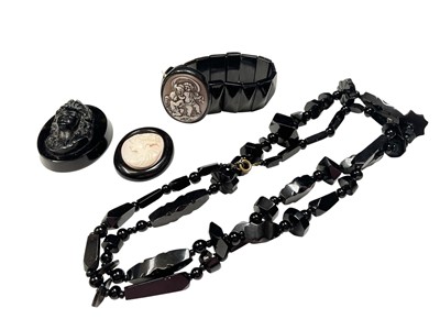 Lot 173 - Antique jet bead necklace, Victorian carved cameo and jet/black bracelet and two similar panels
