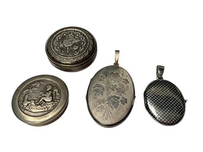 Lot 174 - 19th century Russian silver and niello work locket, vintage silver locket and two white metal pill boxes (4)
