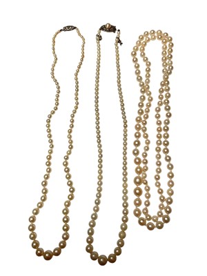 Lot 176 - Three cultured pearl necklaces, two with marcasite clasps and one continuous single string