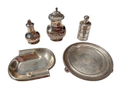 Lot 38 - Victorian silver circular dish, German silver (830) pin dish, two silver pepperettes and a Chinese white metal pepperette (5)