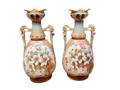 Lot 2274 - Pair of Art Nouveau vases with hand painted floral decoration, circa 1900.