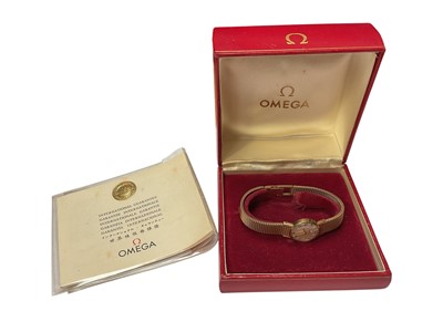 Lot 225 - Ladies' Omega 9ct gold wristwatch with integral 9ct gold mesh bracelet, boxed and papers