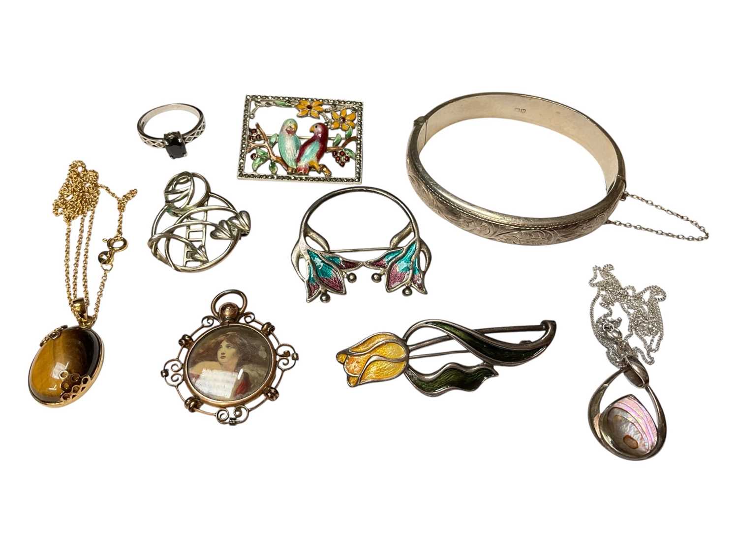 Lot 52 - 1940s silver hinged bangle (Chester 1949), Art Nouveau style silver and enamel brooches, silver gilt tiger's eye pendant on chain, other silver jewellery