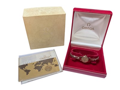 Lot 53 - 1970s Omega 9ct gold cased ladies' wristwatch on an Excalibur gold plated expandable bracelet, in original boxes with paperwork and original receipt dated 25/8/72.