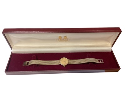 Lot 210 - Ladies' Garrard 9ct gold quartz wristwatch with an integral 9ct gold mesh bracelet, boxed