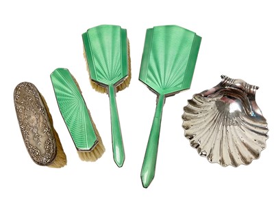 Lot 433 - Regency shell shaped butter dish, a silver brush and set of plated enamelled dressing table pieces