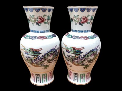 Lot 2243 - Pair of porcelain vases - The Dance of the Celestial Dragon, 26cm high