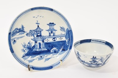 Lot 261 - Lowestoft blue and white Chinese landscape tea bowl and saucer, circa 1780