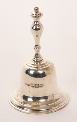 Lot 471 - George V silver table bell of conventional form with turned handle (London 1912), maker Asprey & Co Ltd, also stamped Asprey London to underside, 5.83ozs, 10cm in overall height.