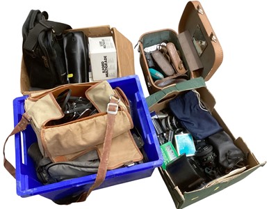 Lot 2970 - Group of cameras, lenses and accessories, mostly vintage, including a Canon AV-1, Canon AE-1, Olympus OM10, etc