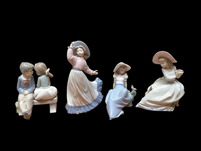 Lot 2285 - Four Nao porcelain figures including Caught in the Breeze, all boxed