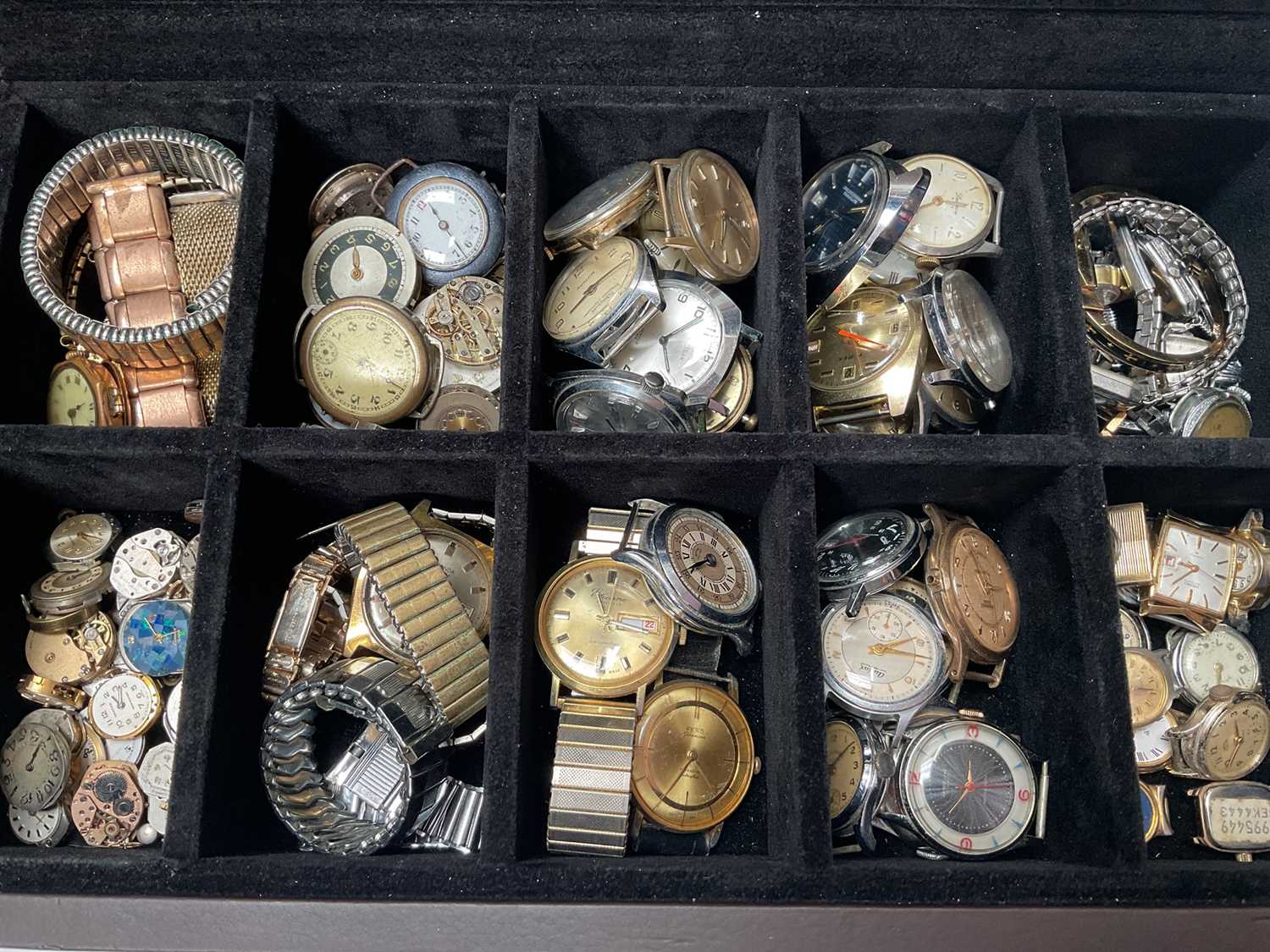 Lot 95 - Collection of vintage and later wristwatches, watch movements, straps and various parts, within a watch display box