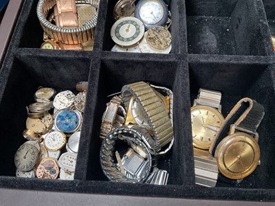 Lot 95 - Collection of vintage and later wristwatches, watch movements, straps and various parts, within a watch display box