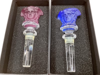 Lot 2292 - Two Rosenthal for Versace coloured glass wine bottle stoppers in original boxes