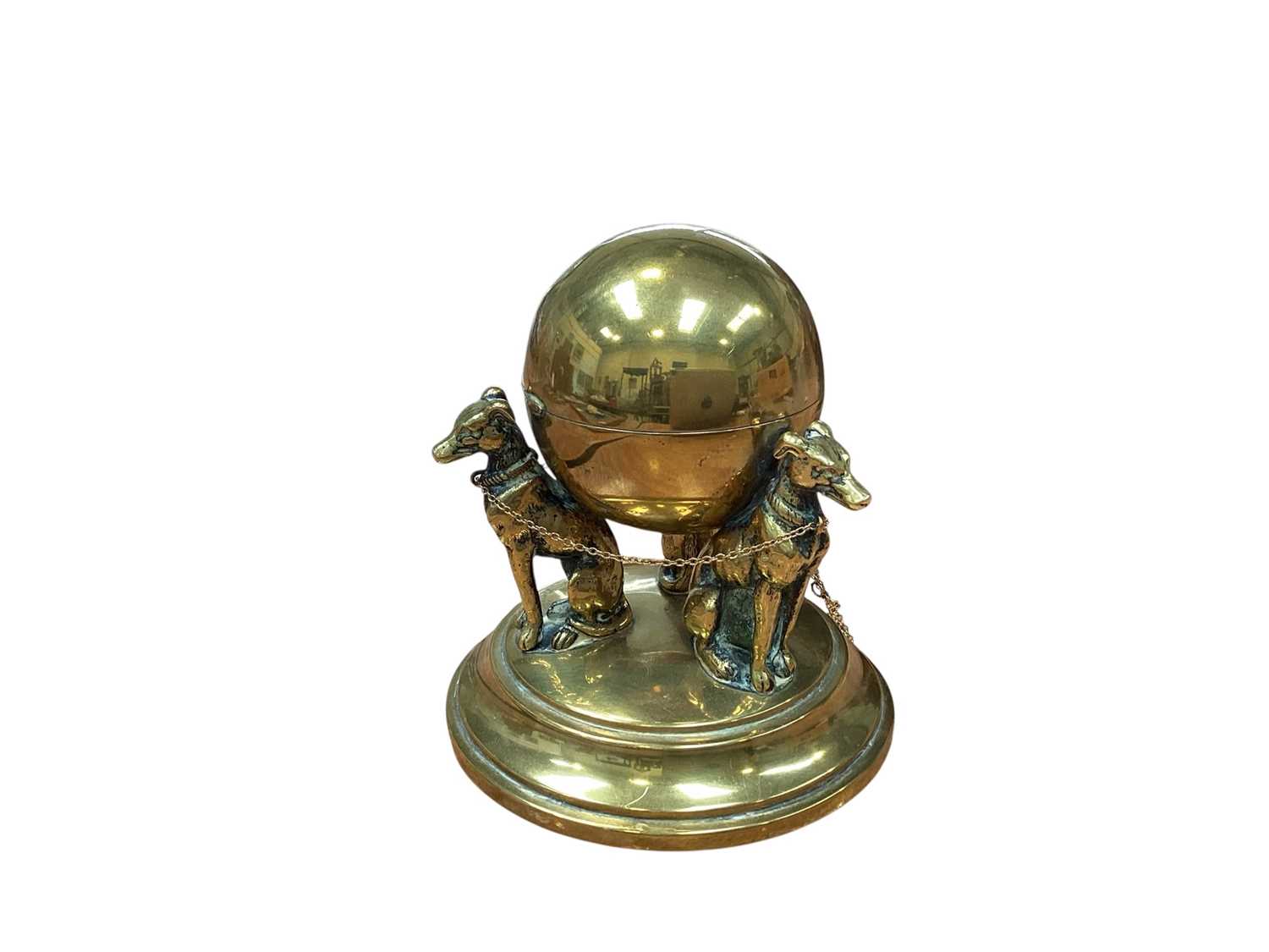 Lot 5022 - Brass inkwell in the form of three seated dogs supporting a round inkwell