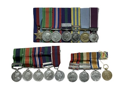 Lot 717 - Group of three miniature medal groups comprising Queen's South Africa medal, King's South Africa medal, War and Victory medals. 1939-1945 Star, Defence, War, General Service, Korea, United Nat...