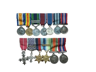 Lot 718 - Group of two miniature medal groups comprising M.B.E. (Military type), Distinguished Flying Cross with bar, 1939-1945 Star, Atlantic Star with Air Crew Europe clasp, Defence and War medals. Th...