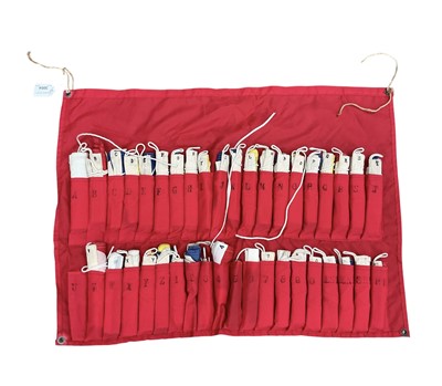 Lot 3004 - Collection of vintage nautical pennants and signalling flags in a canvas holder.
