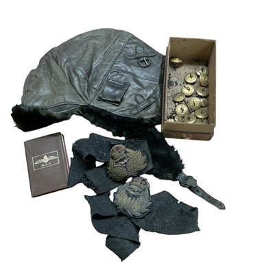 Lot 733 - Good quality 1920s / 30s leather flying helmet with rabbit fur lining and Gieves Ltd label to interior, together with two cap tallies and naval buttons.