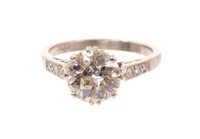 Lot 606 - Edwardian diamond single stone ring with an old cut diamond estimated to weigh approximately 1.95-2.00ct, in coronet setting, diamond set shoulders on platinum shank