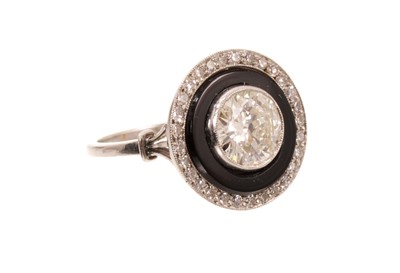 Lot 607 - Art Deco diamond and onyx ring with a central old cut diamond estimated to weigh approximately 1.3cts, in platinum setting