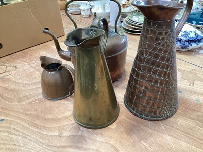 Lot 5024 - Three copper jugs and a copper kettle (4)