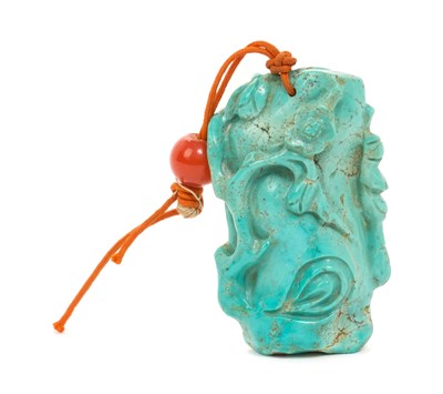 Lot 31 - Formerly the property of William Tallon R.V.M., Antique Chinese carved bluestone pendant of naturalistic trunk form with floral and leaf decoration on silk cord suspension 5.5 x 3cm Sold by thes...