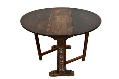 Lot 1374 - Rare mid 17th century and later, oak oval drop-leaf table