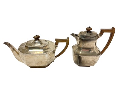 Lot 466 - George V silver teapot of faceted octagonal form, with angular fruitwood handle and finial, together with a matching hot water pot, (Sheffield 1926), maker Reid & Sons