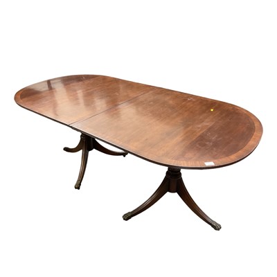 Lot 1340 - Georgian-style twin pedestal dining table, on tripod supports