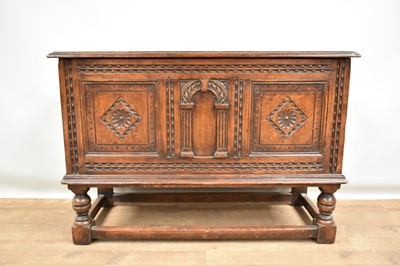 Lot 1371 - 17th century revival oak coffer on stand, with carved decoration, on turned supports joined by stretchers