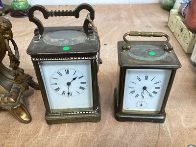 Lot 5067 - Two brass cased carriage clocks, a French brass cased and porcelain clock and a 19th century mahogany cased banjo barometer (4)