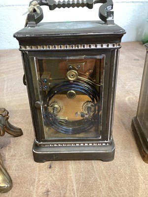 Lot 5067 - Two brass cased carriage clocks, a French brass cased and porcelain clock and a 19th century mahogany cased banjo barometer (4)