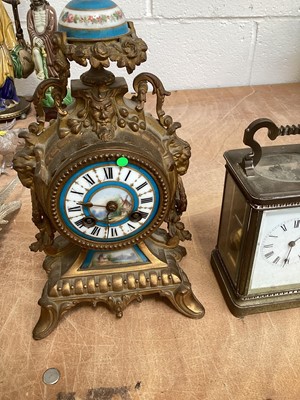 Lot 5067 - Two brass cased carriage clocks, a French brass cased and porcelain clock and a 19th century mahogany cased banjo barometer (4)