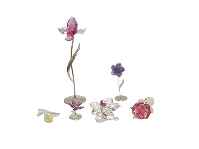Lot 2316 - Six Swarovski flower ornaments including Darany Tanzanite and Dorora Fuchsia Rain Orchid, all boxed