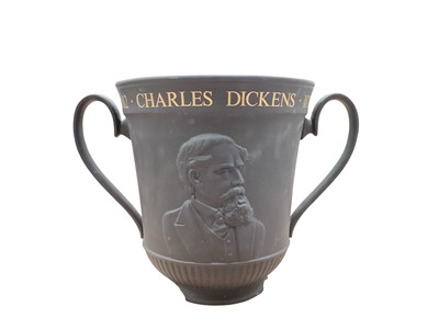 Lot 2321 - Royal Doulton black basalt Charles Dickens 1870-1970 Centenary twin handle trophy vase