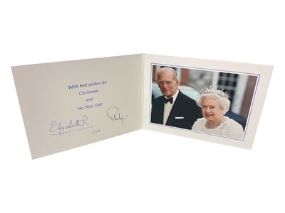 Lot 44 - H.M. Queen Elizabeth II and H.R.H. The Duke of Edinburgh, signed 2011 Christmas card with twin gilt cyphers to cover, colour photograph of the smiling Royal couple to the interior, signed 'Elizabe...