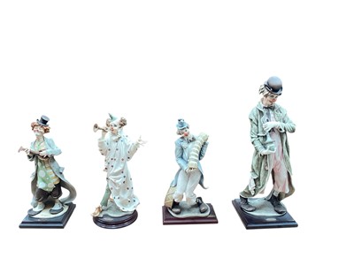 Lot 2324 - Four Florence Giuseppe Armani clowns including The Musical Clown, tallest is 46cm high