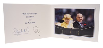 Lot 47 - H.M. Queen Elizabeth II and H.R.H. The Duke of Edinburgh signed 2015 Christmas card with twin gilt cyphers to cover, colour photograph of the smiling Royal couple riding in a carriage at Royal As...