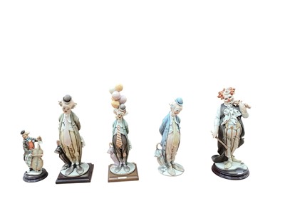 Lot 2325 - Five Florence Giuseppe Armani clowns including The Happy Fiddler, tallest is 35cm high, all boxed