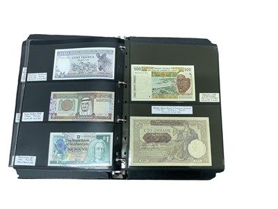 Lot 472 - World - An album containing mixed banknotes of the world, mostly uncirculated and well presented with individual descriptions of each note (161 banknotes)