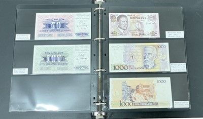 Lot 473 - World - An album containing mixed banknotes of the world, mostly uncirculated and well presented with individual descriptions of each note (198 banknotes)